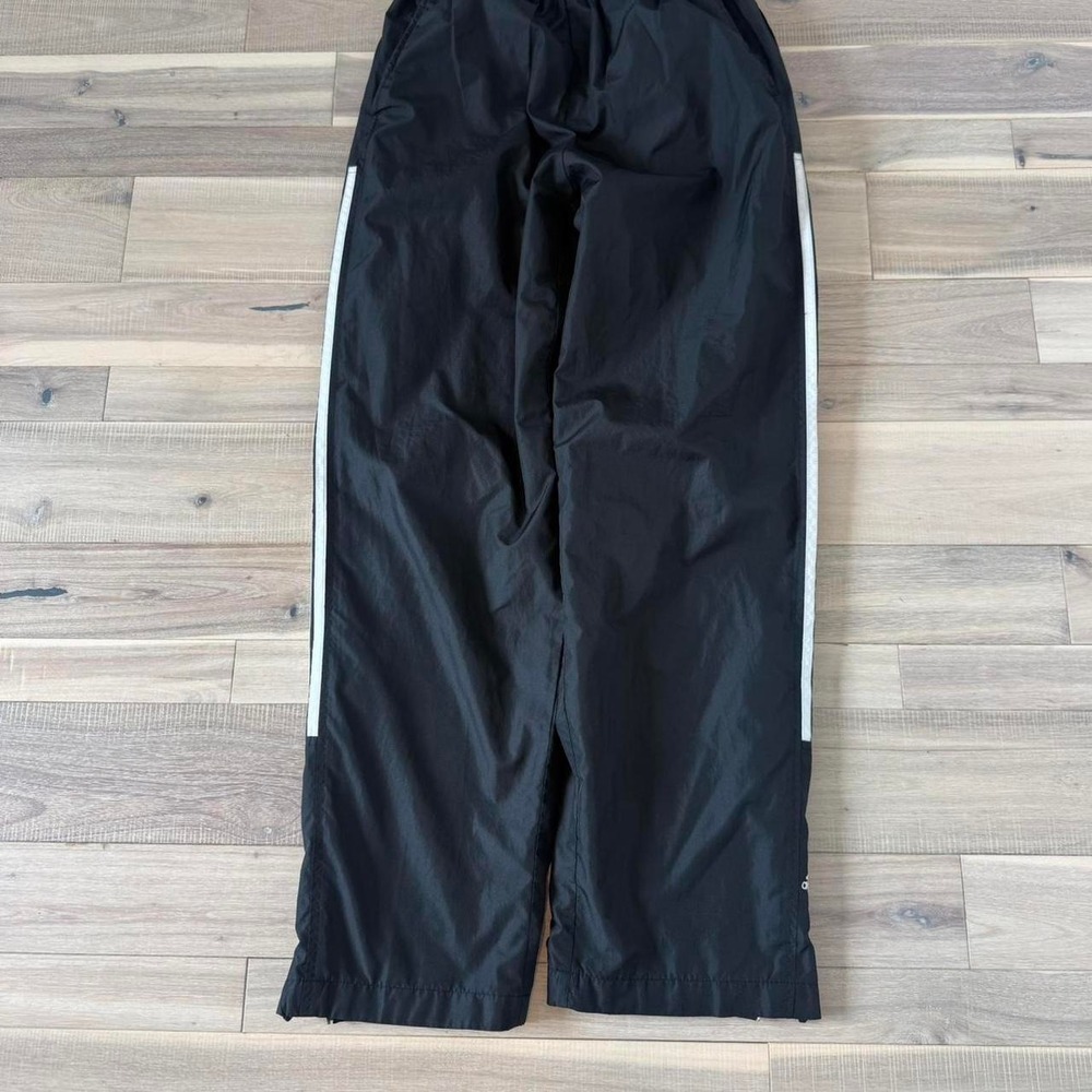 2000s Y2K baggy Adidas black track pants with white stripes Size M